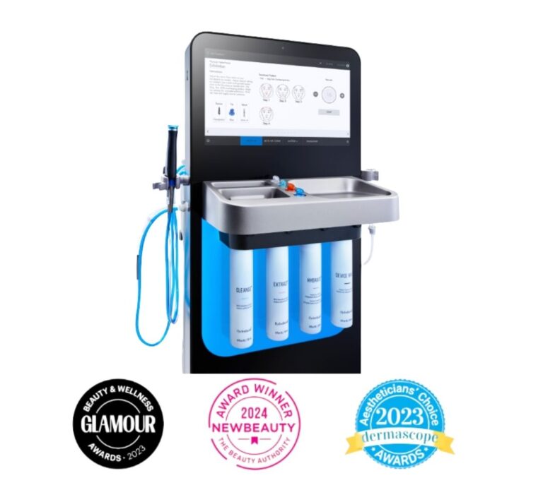 Professional HydraFacial machine setup displayed with skincare awards.